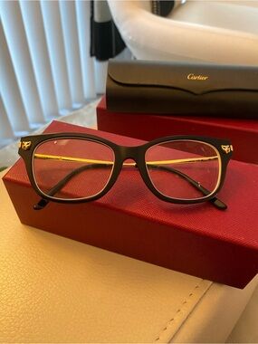 Cartier Black Frames with Gold Temples